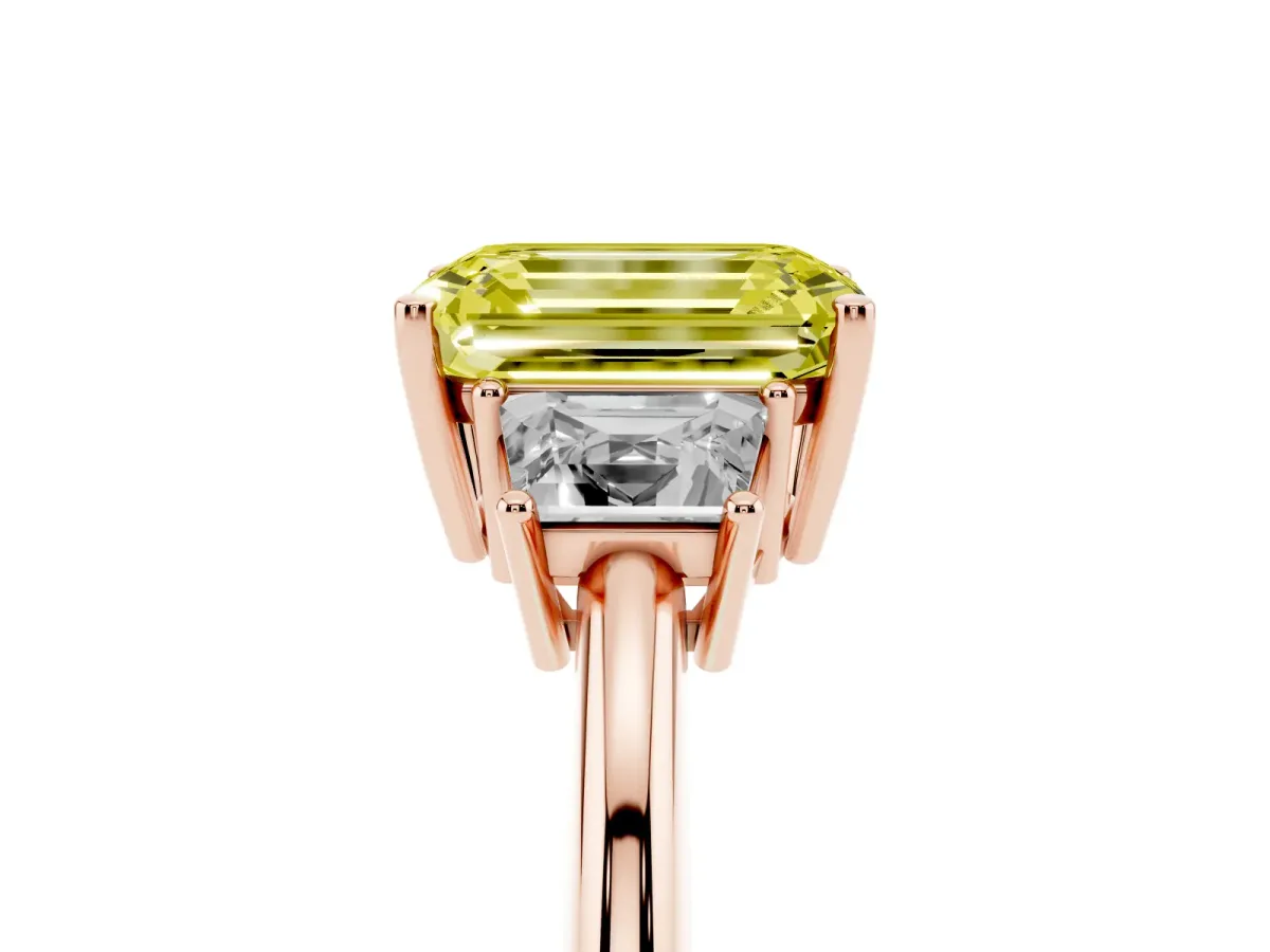 Fancy Yellow Emerald Cut Diamond Three-Stone Ring with Trapezoid Side Stones and Prong Setting Rose gold