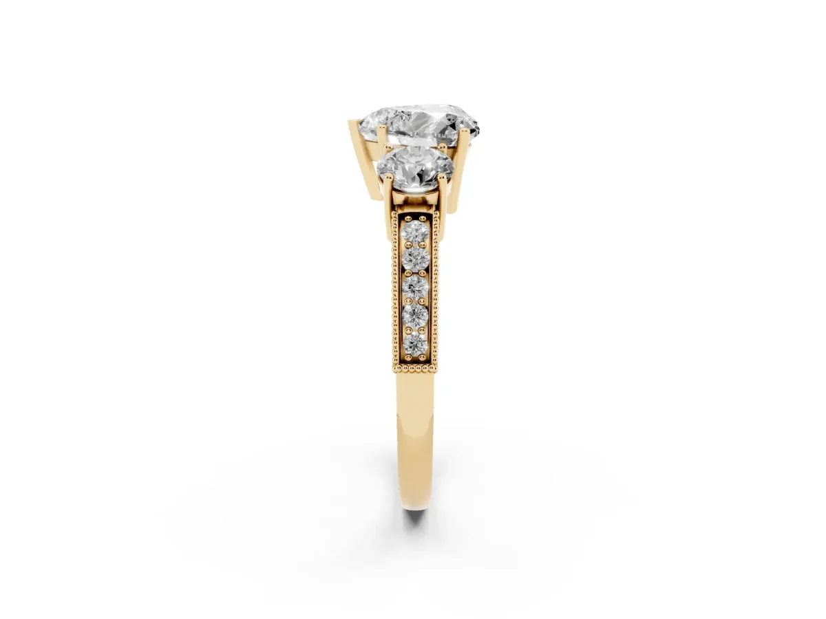 Heart Cut Three-Stone Diamond Ring with Pavé Band and Four-Prong Setting Yellow gold