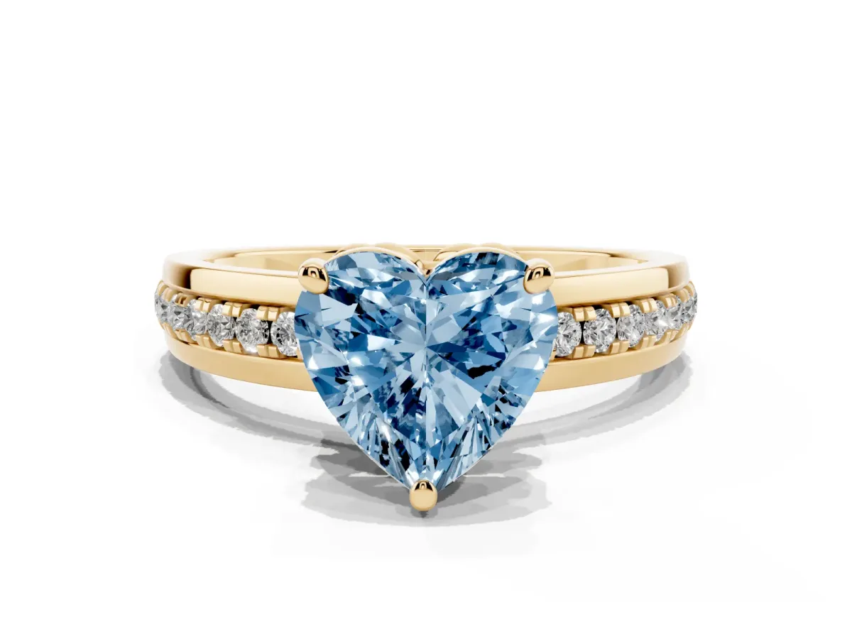 Fancy Blue Heart Cut Solitaire Diamond Ring with Channel Set Band and Six-Prong Setting Yellow gold