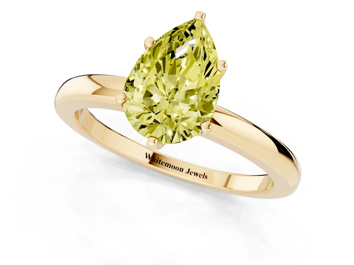 Fancy Yellow Pear Cut Solitaire Diamond Ring with Six-Prong Setting on a Classic Band Yellow gold