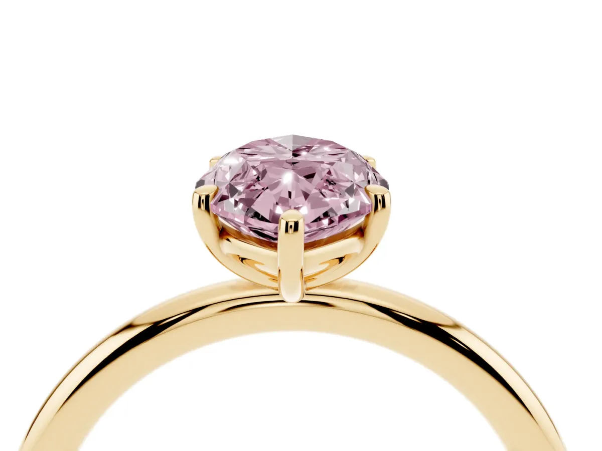 Fancy Pink Oval Cut Solitaire Diamond Ring with Four-Prong Setting on a Plain Band Yellow gold