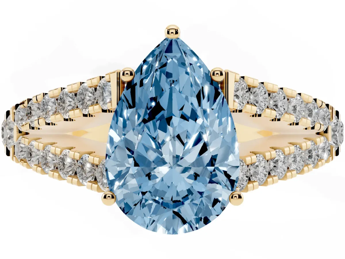 Fancy Blue Pear Cut Diamond Split Shank Engagement Ring with Round Pavé and Prong Setting Yellow gold
