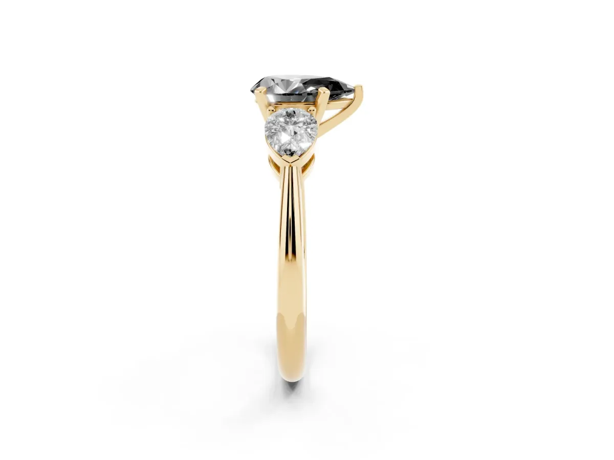 Fancy Black Three-Stone Pear Cut Diamond Ring with Pear Side Stones and Four-Prong Setting Yellow gold