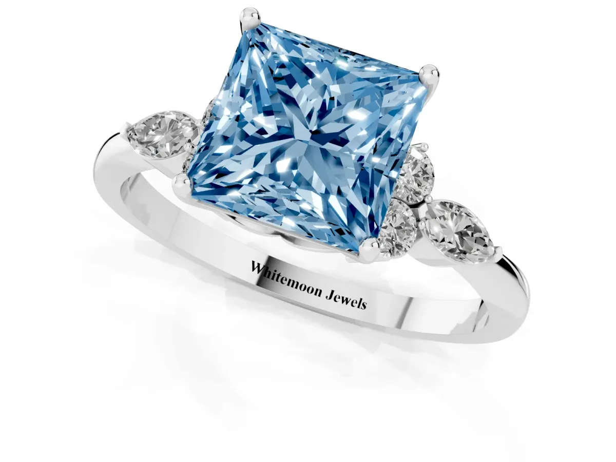 Fancy Blue Princess Cut Brilliant Diamond Solitaire Ring with Pear Side Stones and Four-Prong Setting Silver