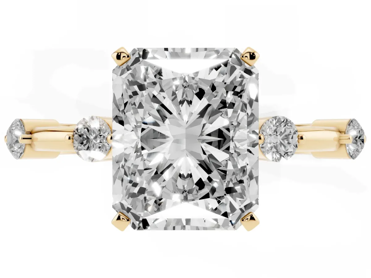 Radiant Cut Solitaire Diamond Ring with Bezel Set Side Stones and Prong Setting Yellow gold