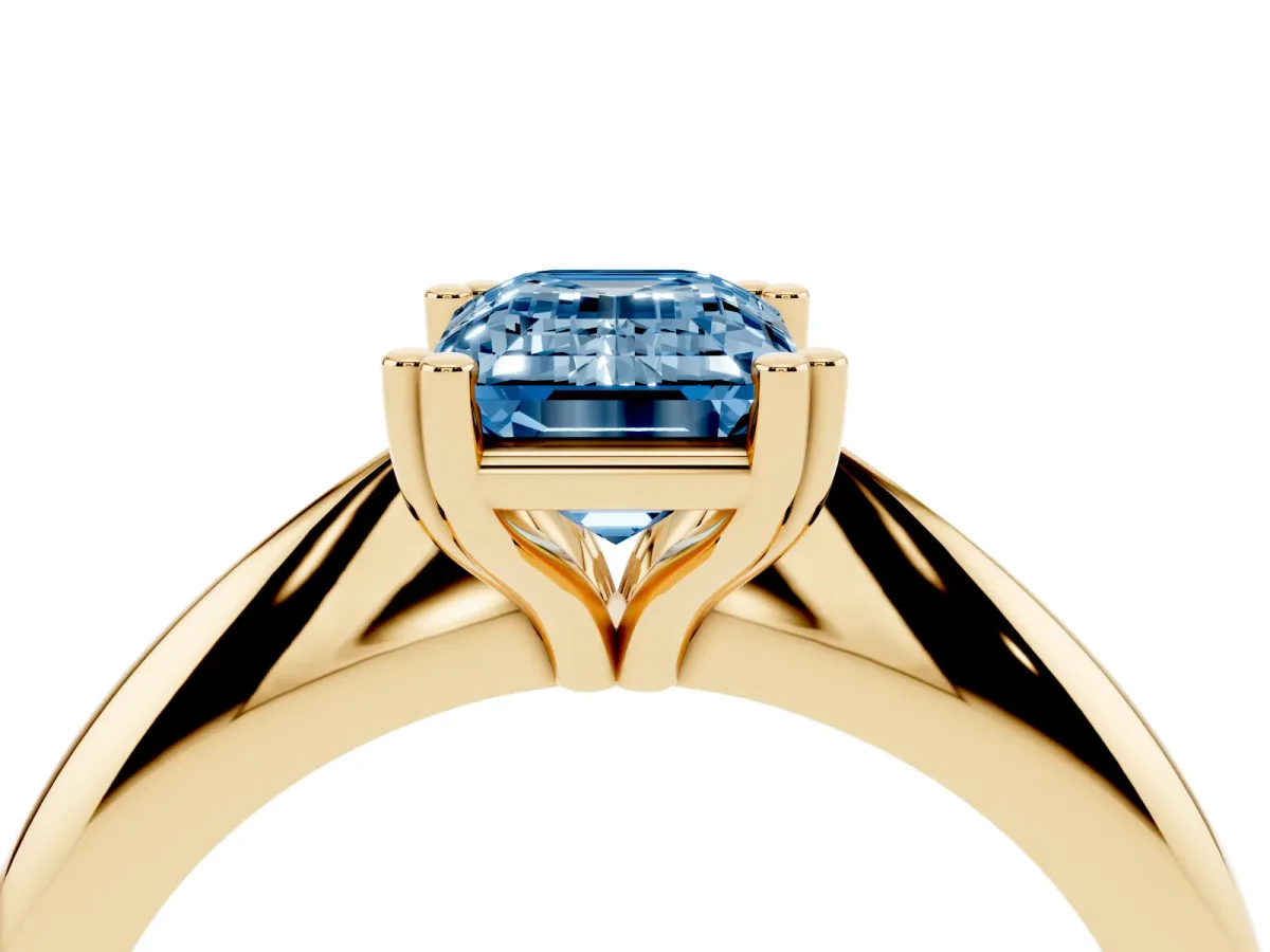 Fancy Blue Emerald Cut Cut Solitaire Engagement Ring with Tapered Band and Four-Prong Setting Yellow gold