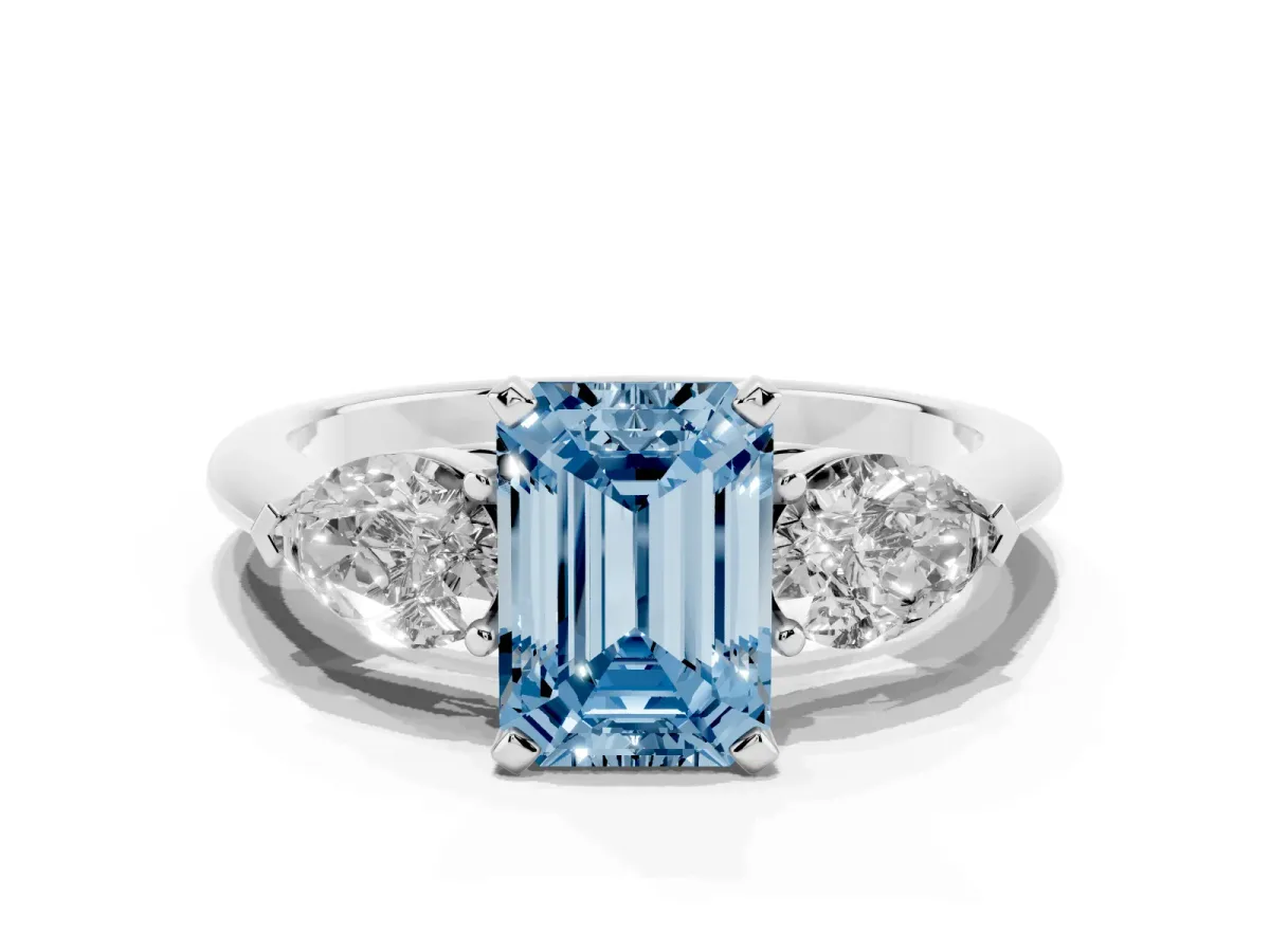 Fancy Blue Three-Stone Emerald Cut Diamond Ring with Pear Side Stones and Four-Prong Setting Platinum