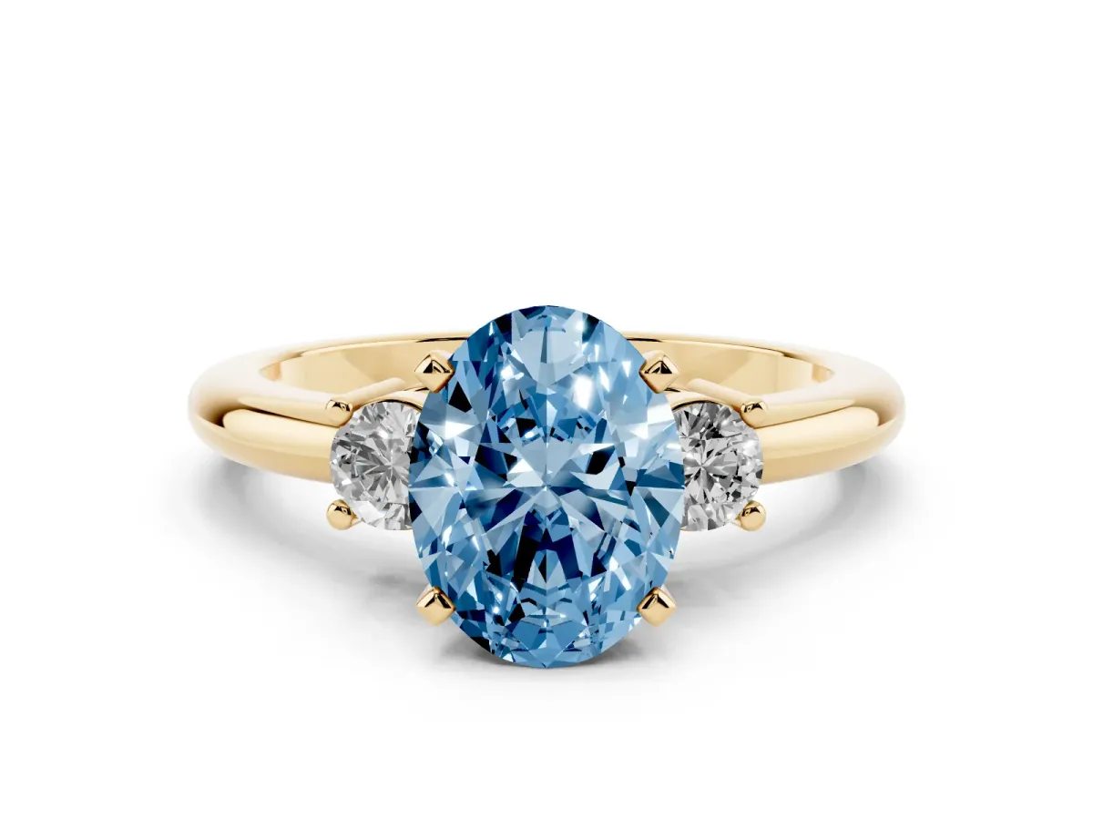 Fancy Blue Three-Stone Oval Cut Cut Diamond Solitaire with Prong Setting and Classic Band Yellow gold
