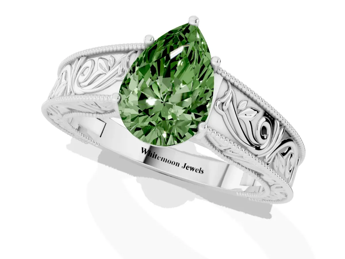 Fancy Green Pear Cut Diamond Solitaire Ring with Engraved Band and Four-Prong Setting Silver