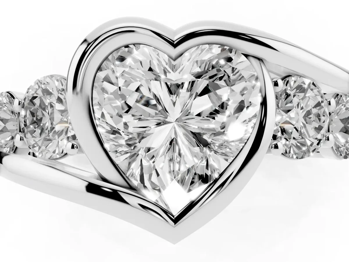 Bezel Set Heart Cut Diamond Bypass Ring with Round Accents Platinum