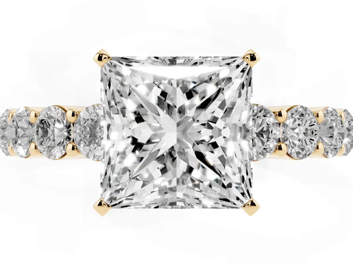 Princess Cut Diamond Solitaire Ring with Shared Prong Round Side Stones Yellow gold