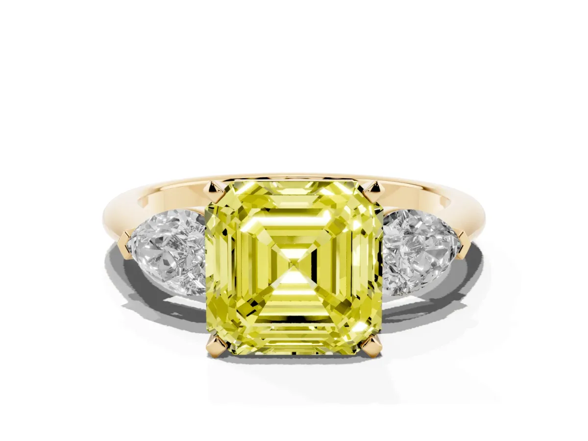 Fancy Yellow Three-Stone Asscher Cut Diamond Ring with Pear Side Stones and Four-Prong Setting Yellow gold