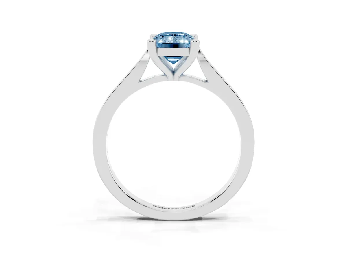 Fancy Blue Emerald Cut Solitaire Diamond Ring with Four-Prong Setting and Tapered Band Silver