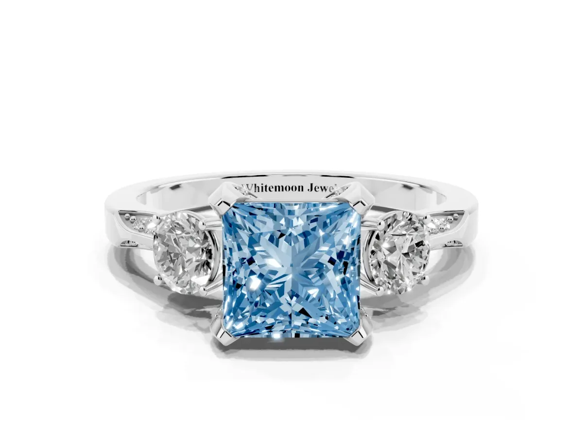 Fancy Blue Princess Cut Brilliant Three-Stone Diamond Ring with Pavé Band and Four-Prong Setting Silver