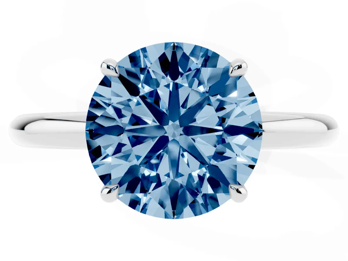 Fancy Blue Round Cut Diamond Solitaire Ring with Thin Band and Four-Prong Setting Silver