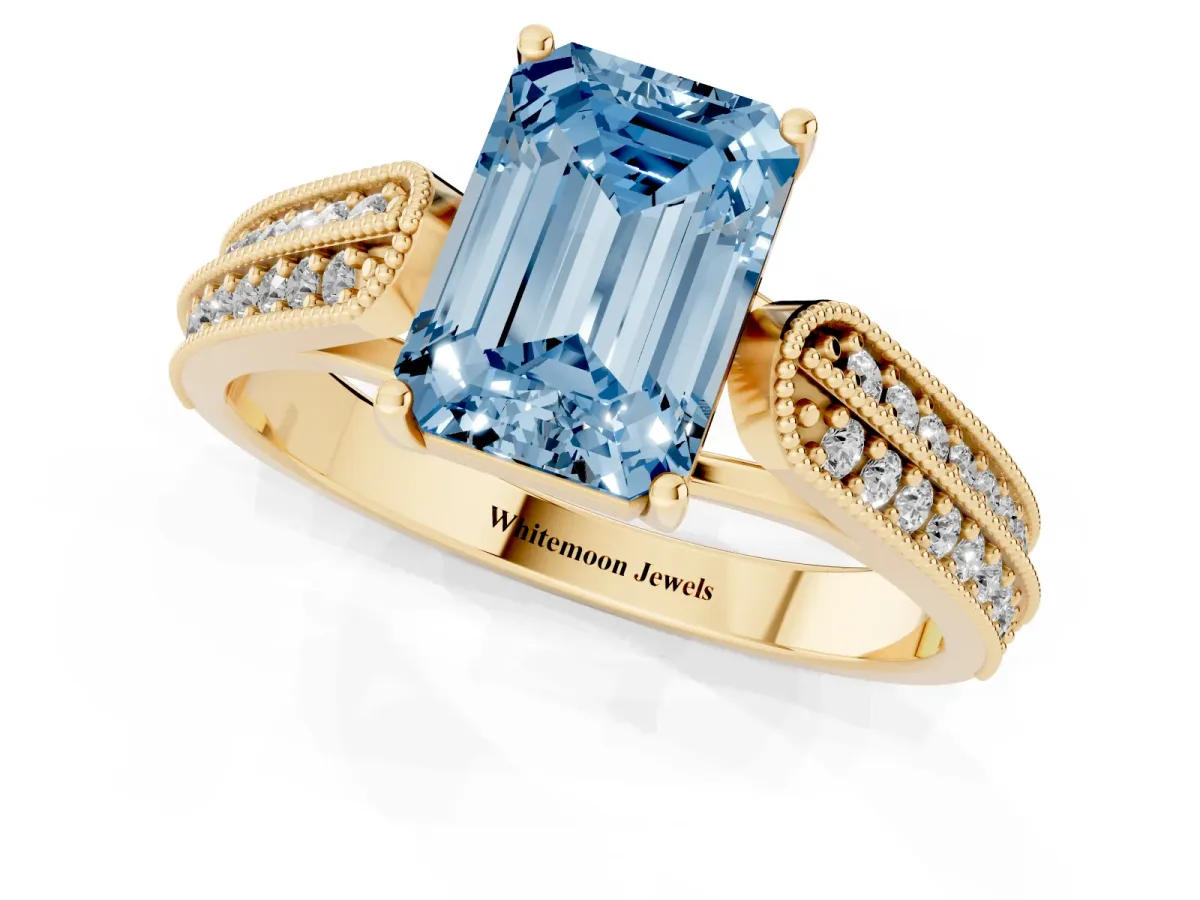 Fancy Blue Emerald Cut Cut Pave Split Shank Engagement Ring with Four-Prong Setting Yellow gold