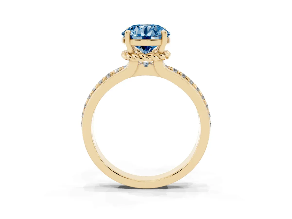 Fancy Blue Round Cut Solitaire Diamond Ring with Channel Set Band and Six-Prong Setting Yellow gold