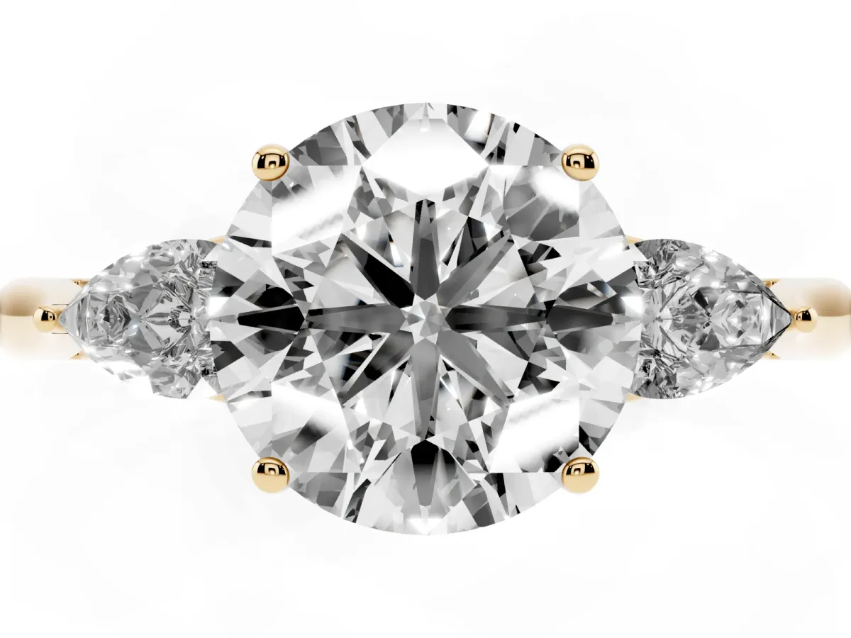 Three-Stone Round Cut Brilliant Diamond Solitaire Ring with Tapered Band and Four-Prong Setting Yellow gold