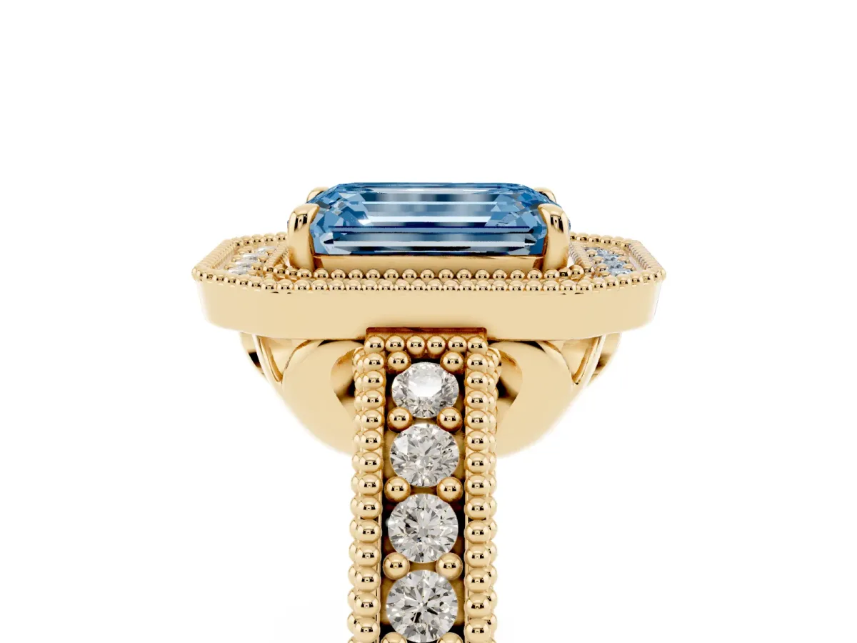 Fancy Blue Emerald Cut Cut Halo Diamond Ring with Pavé Band and Four-Prong Setting Yellow gold