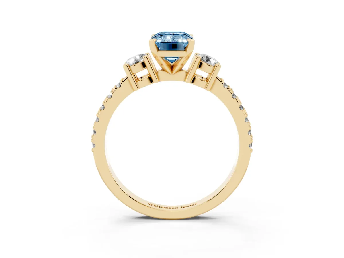 Fancy Blue Emerald Cut Three-Stone Diamond Pavé Band with Prong Setting Yellow gold