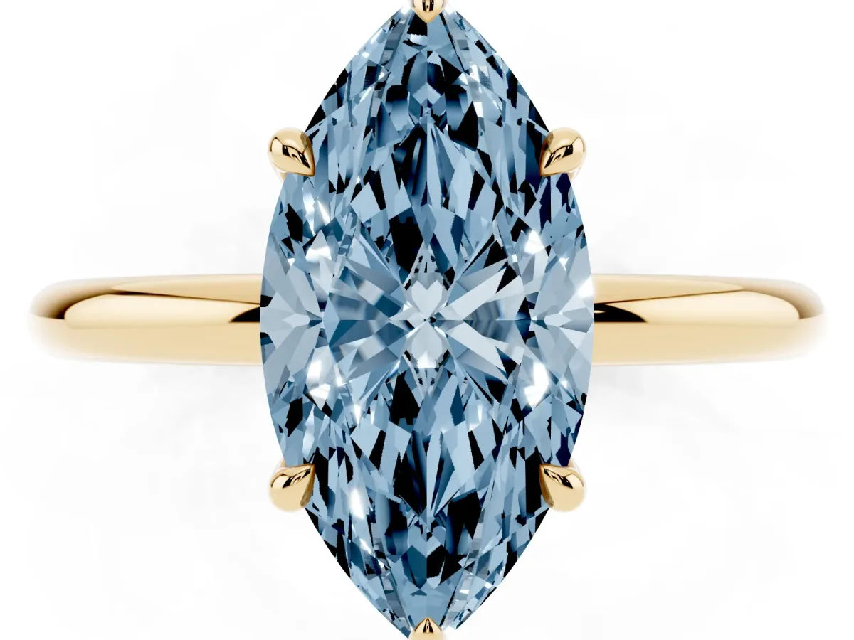 Fancy Blue Marquise Cut Diamond Solitaire Ring with Thin Band and Four-Prong Setting Yellow gold