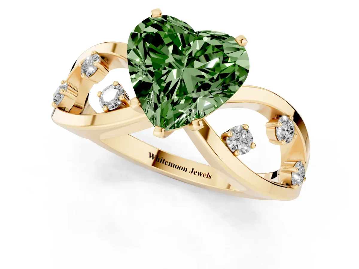 Fancy Green Heart Cut Cut Solitaire Diamond with Side Stones on Criss-Cross Band and Four-Prong Setting Yellow gold
