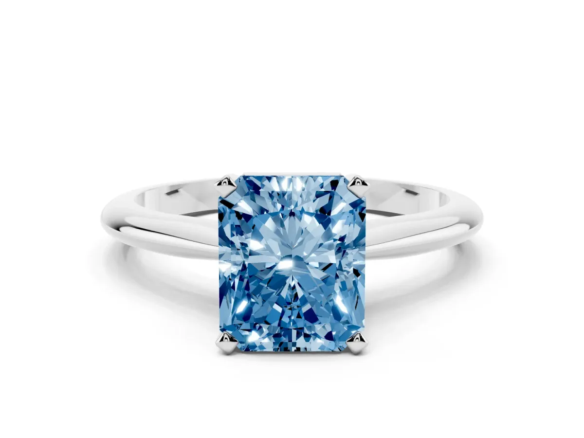 Fancy Blue Radiant Cut Cut Solitaire Ring with Four-Prong Setting on a Classic Band Silver