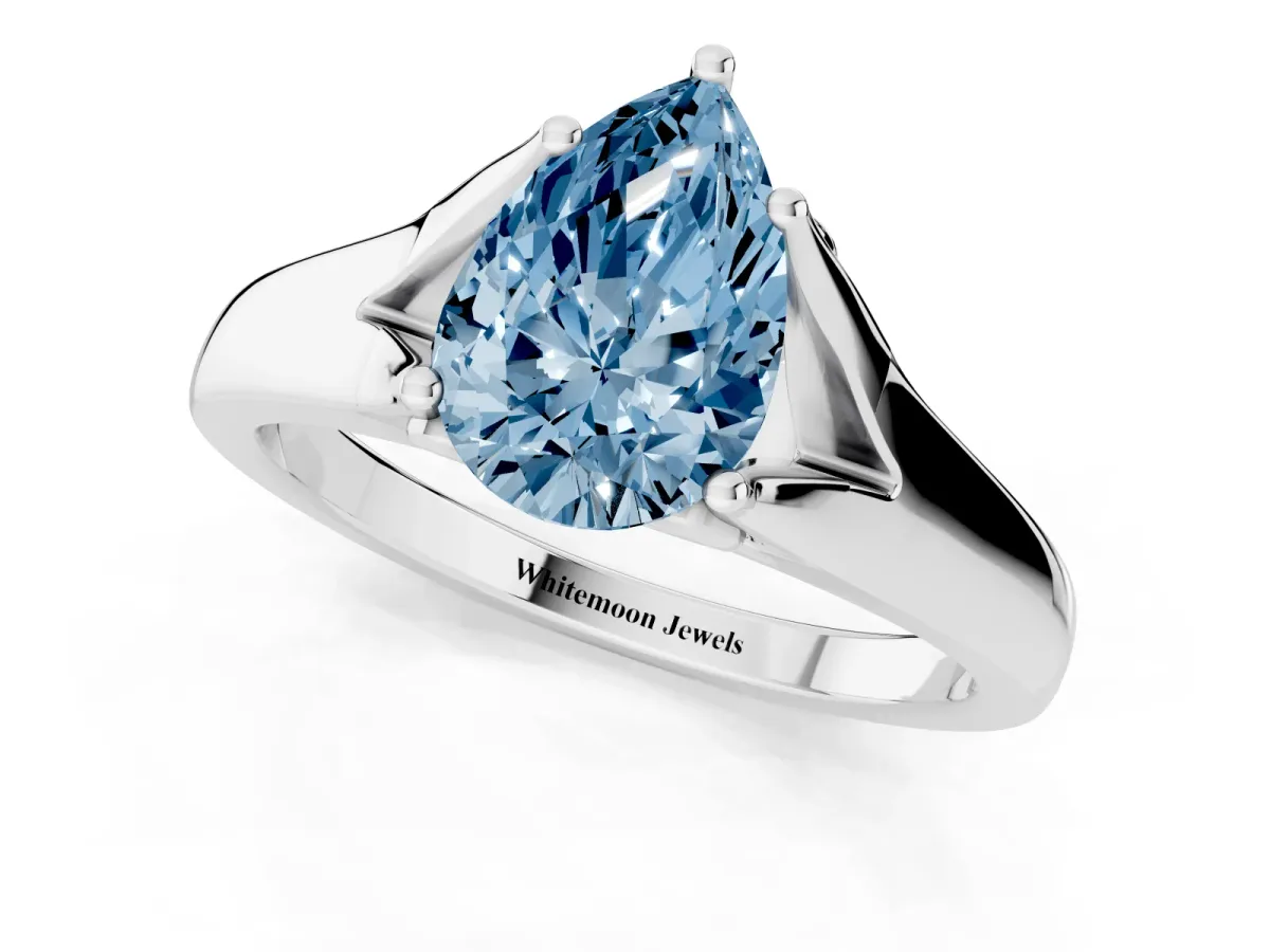 Fancy Blue Pear Cut Solitaire Diamond Ring with Cathedral Band and Four-Prong Setting Platinum