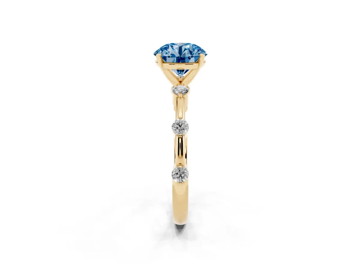 Fancy Blue Round Cut Solitaire Diamond Ring with Bezel Set Side Stones and Prong Setting Yellow gold