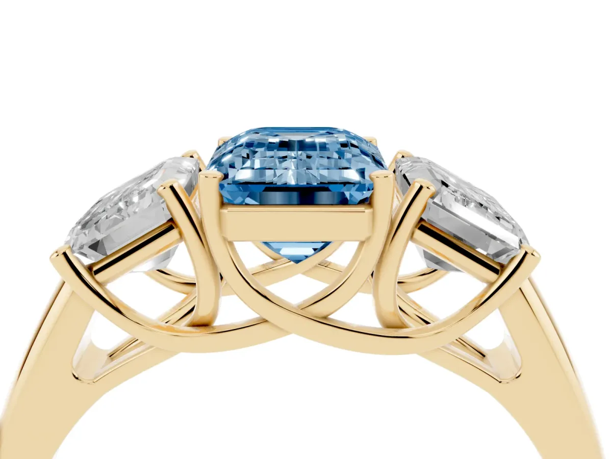 Fancy Blue Three-Stone Emerald Cut Diamond Engagement Ring with Prong Setting Yellow gold