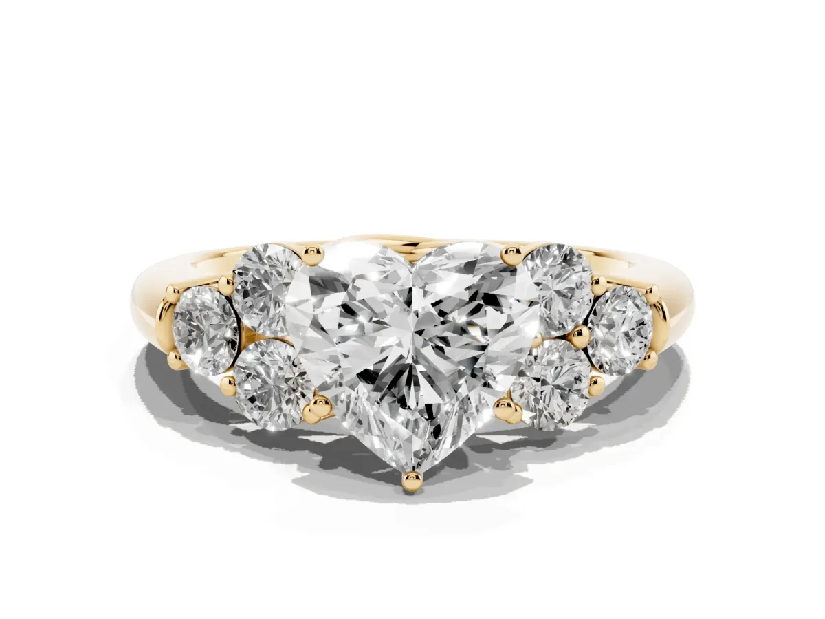 Heart Cut Cut Diamond Cluster Ring with Round Accent Stones and Prong Setting on a Classic Band Yellow gold