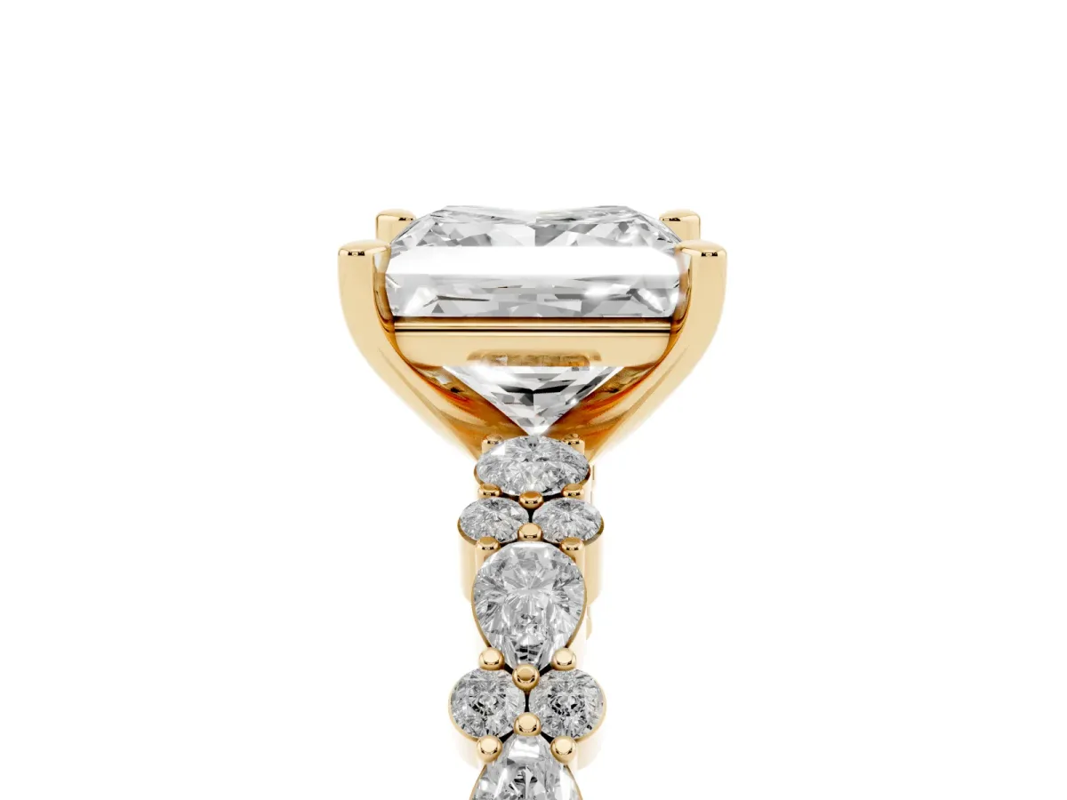 Princess Cut Diamond Side Stone Solitaire Ring with Round and Four-Prong Setting Yellow gold