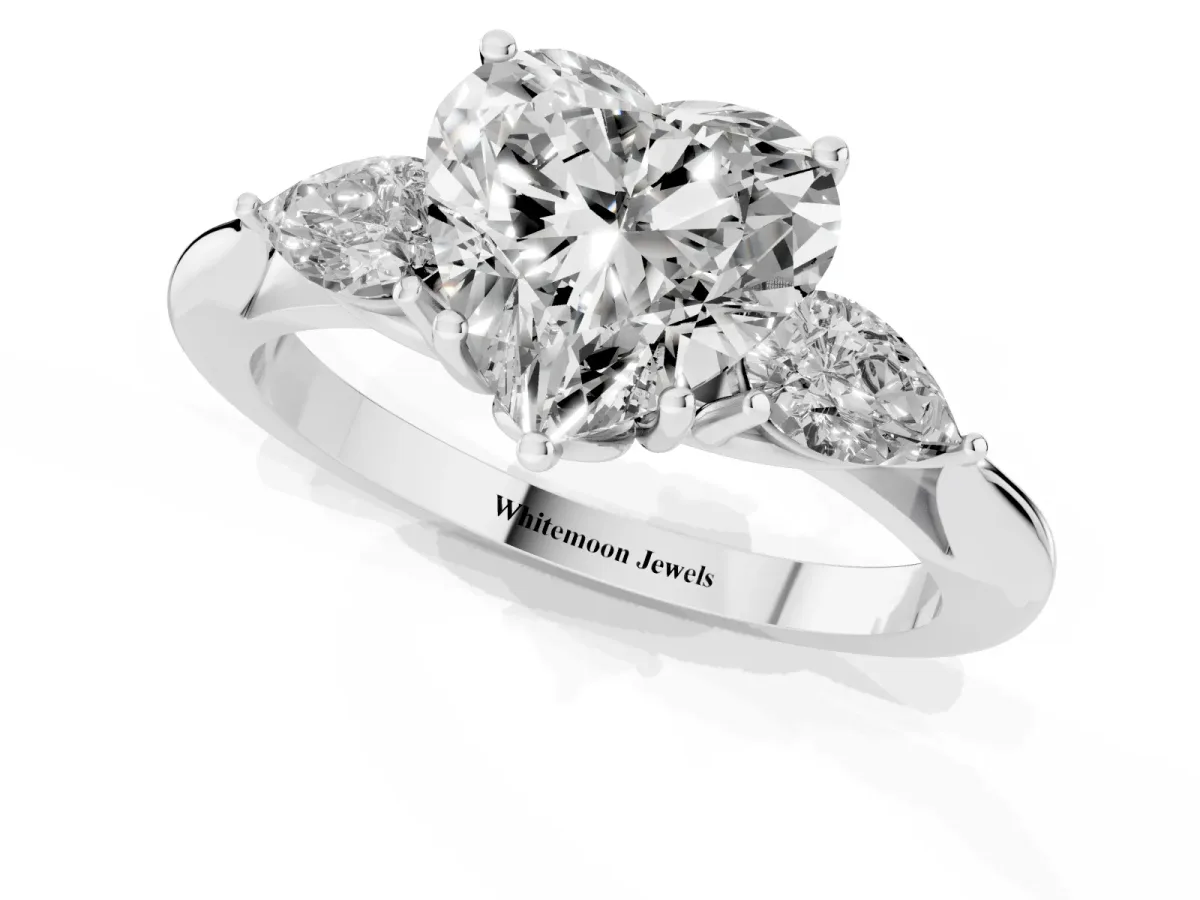 Three-Stone Heart Cut Brilliant Diamond Solitaire Ring with Tapered Band and Four-Prong Setting Silver