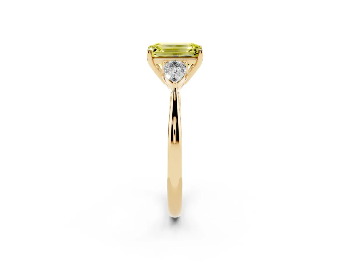 Fancy Yellow Three-Stone Emerald Cut Diamond Ring with Pear Side Stones in Four-Prong Setting Yellow gold
