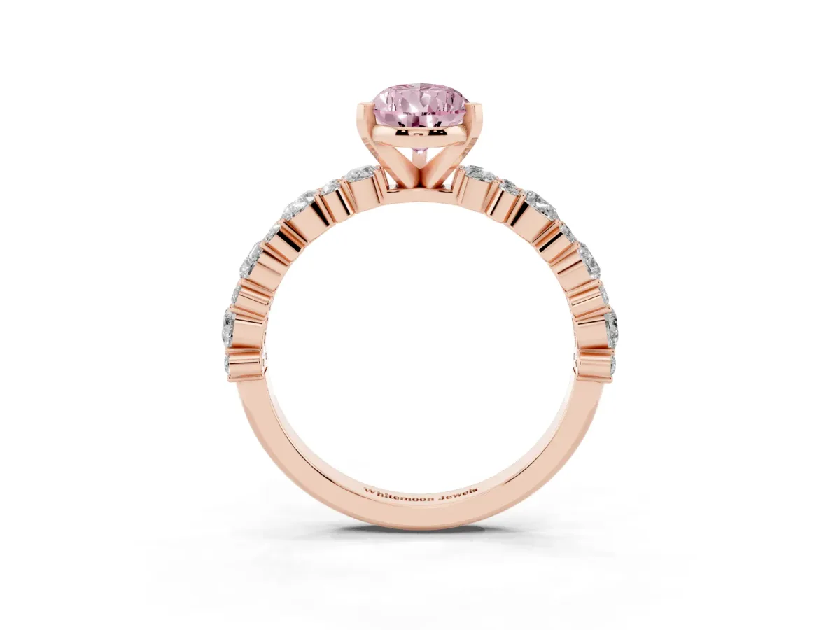 Fancy Pink Pear Cut Diamond Side Stone Solitaire Ring with Round and Four-Prong Setting Rose gold
