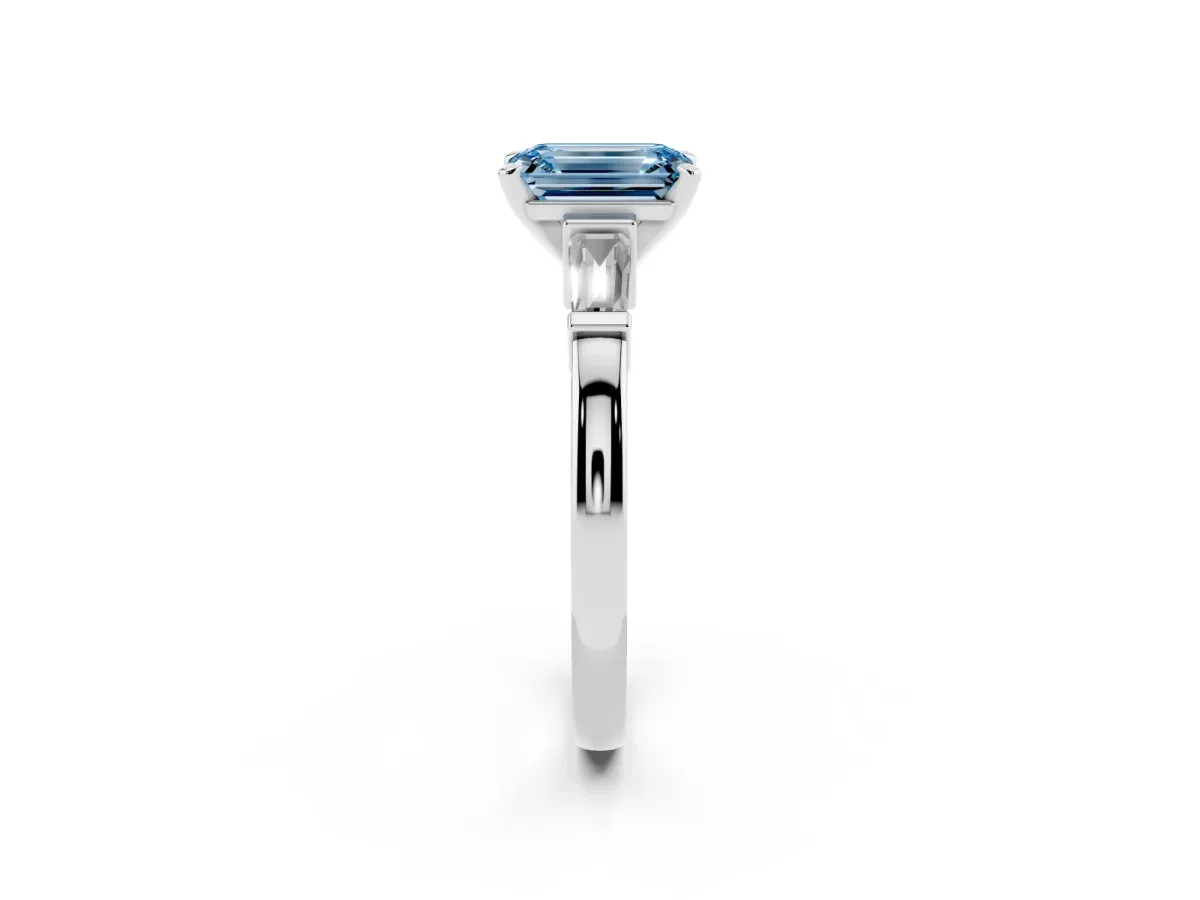 Fancy Blue Emerald Cut Cut Diamond Solitaire Ring with Tapered Baguette Accents and Four-Prong Setting Silver