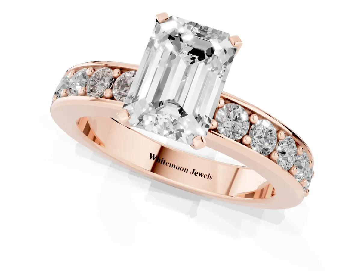Emerald Cut Diamond Engagement Ring with Channel Set Round Band and Prong Setting Rose gold