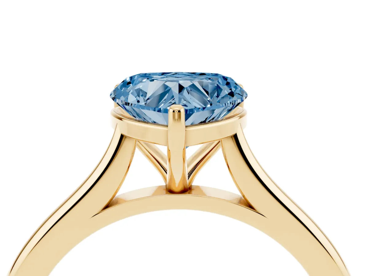 Fancy Blue Heart Cut Cut Solitaire Ring with Cathedral Band and Four-Prong Setting Yellow gold