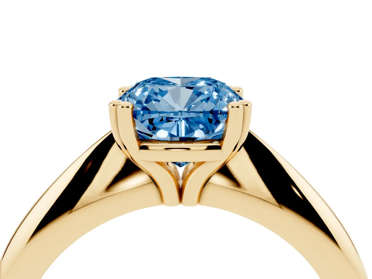 Fancy Blue Cushion Cut Cut Solitaire Engagement Ring with Tapered Band and Four-Prong Setting Yellow gold