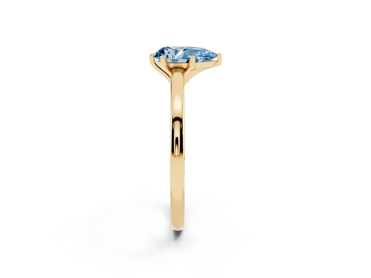 Fancy Blue Pear Cut Solitaire Diamond Engagement Ring with Four-Prong Setting on a Classic Band Yellow gold