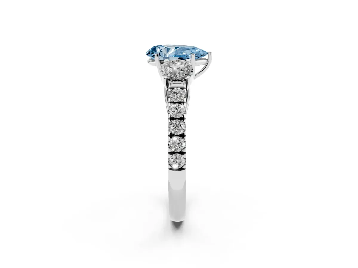 Fancy Blue Pear Cut Cut Diamond Three-Stone Ring with Round Side Stones and Pavé Band Silver