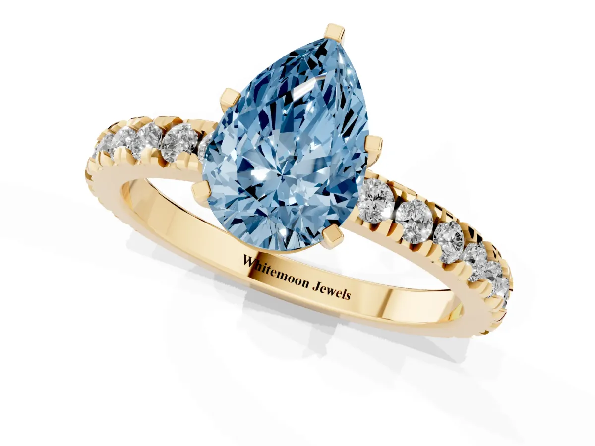 Fancy Blue Pear Cut Diamond Pavé Band Solitaire with Four-Prong Setting Yellow gold