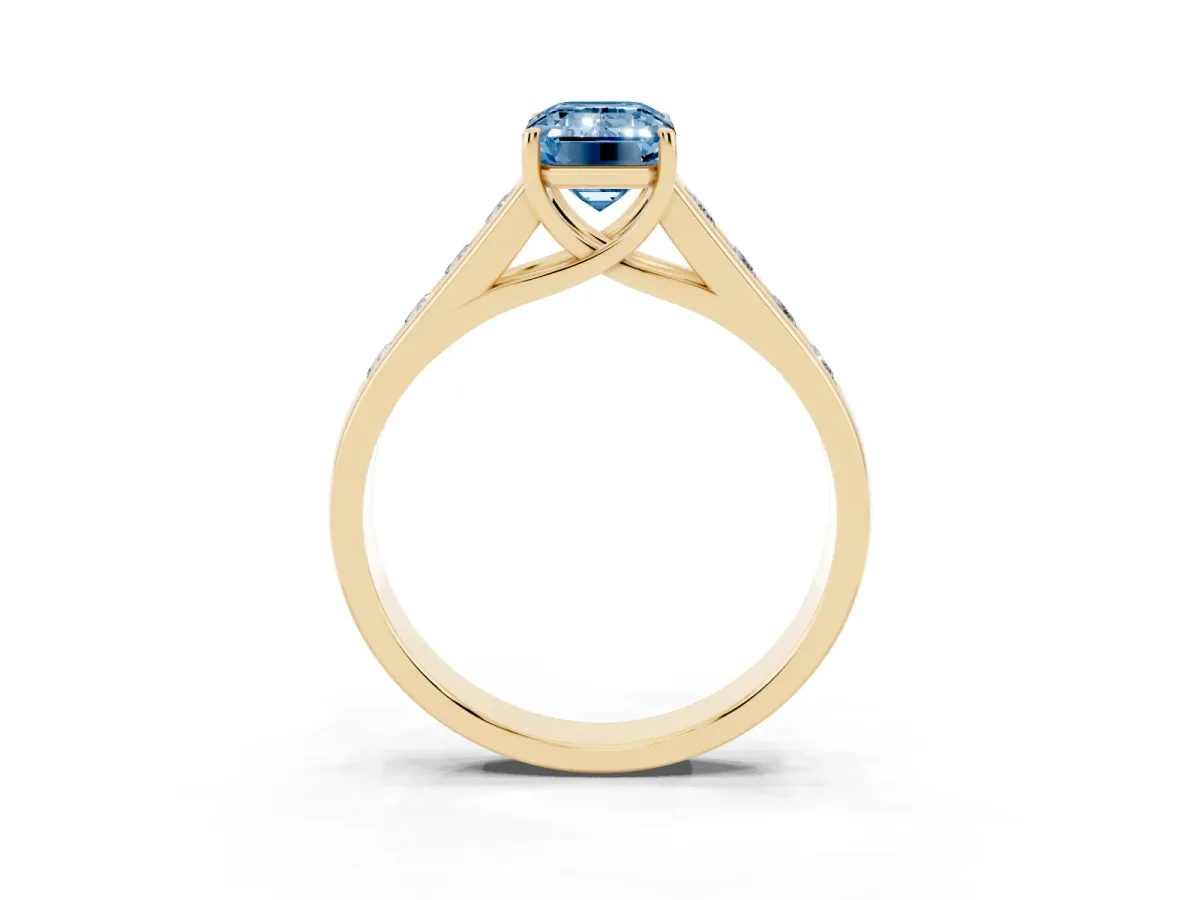 Fancy Blue Emerald Cut Brilliant Channel-Set Solitaire Ring with Four-Prong Setting Yellow gold