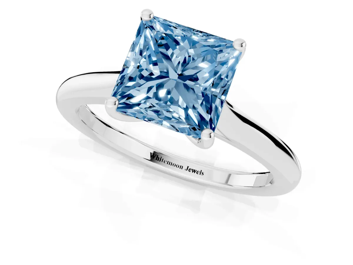 Fancy Blue Princess Cut Cut Solitaire Ring with Cathedral Band and Four-Prong Setting Silver