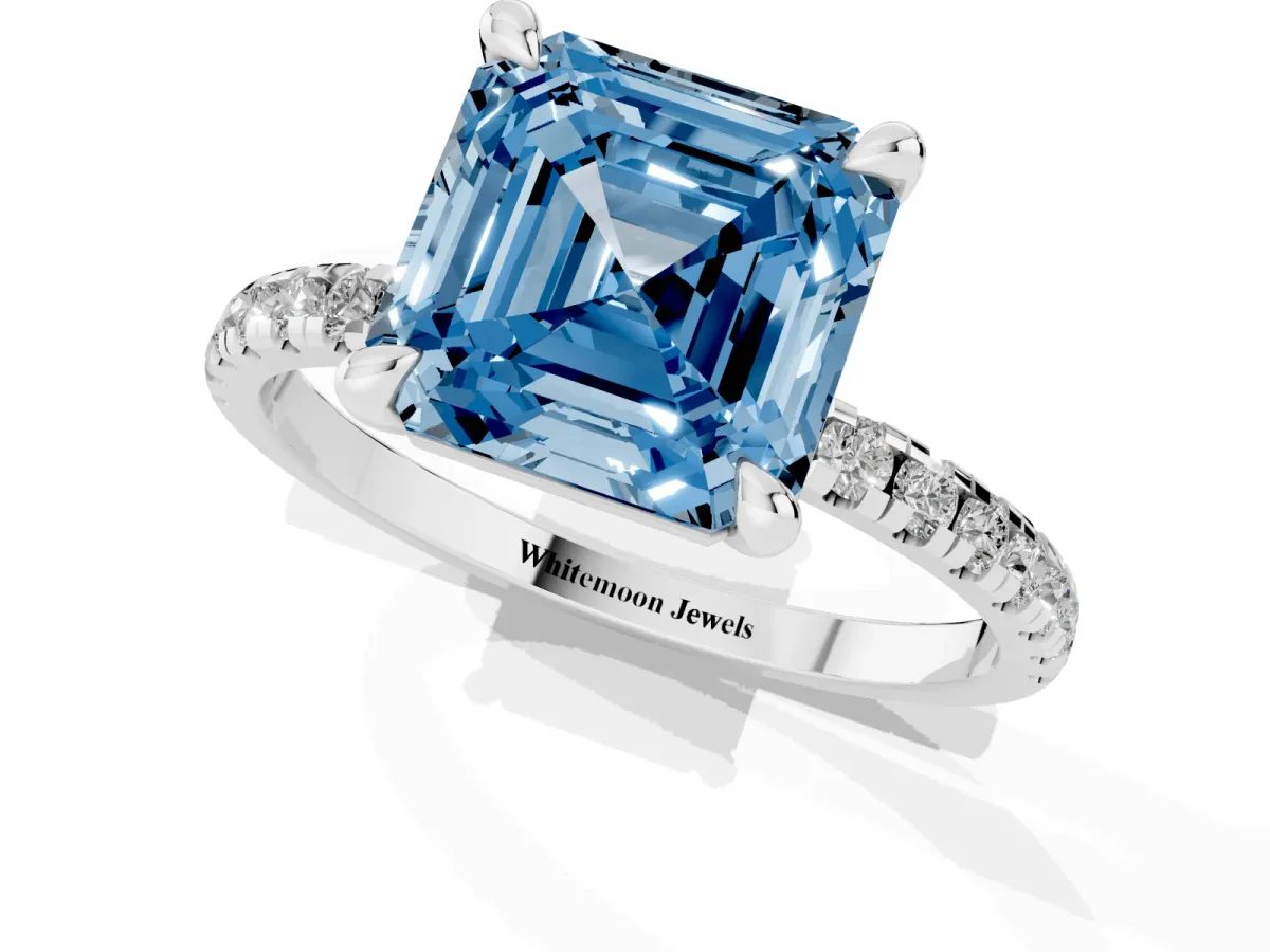 Fancy Blue Asscher Cut Diamond Brilliant Solitaire Ring with Pavé Band and Four-Prong Setting White gold