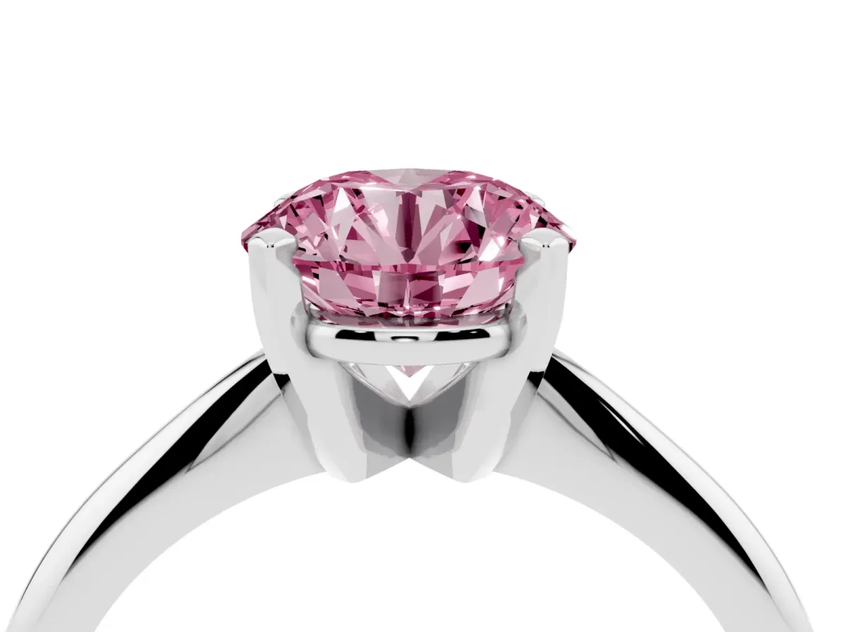 Fancy Pink Round Cut Cut Solitaire Ring with Four-Prong Setting on a Classic Band Silver