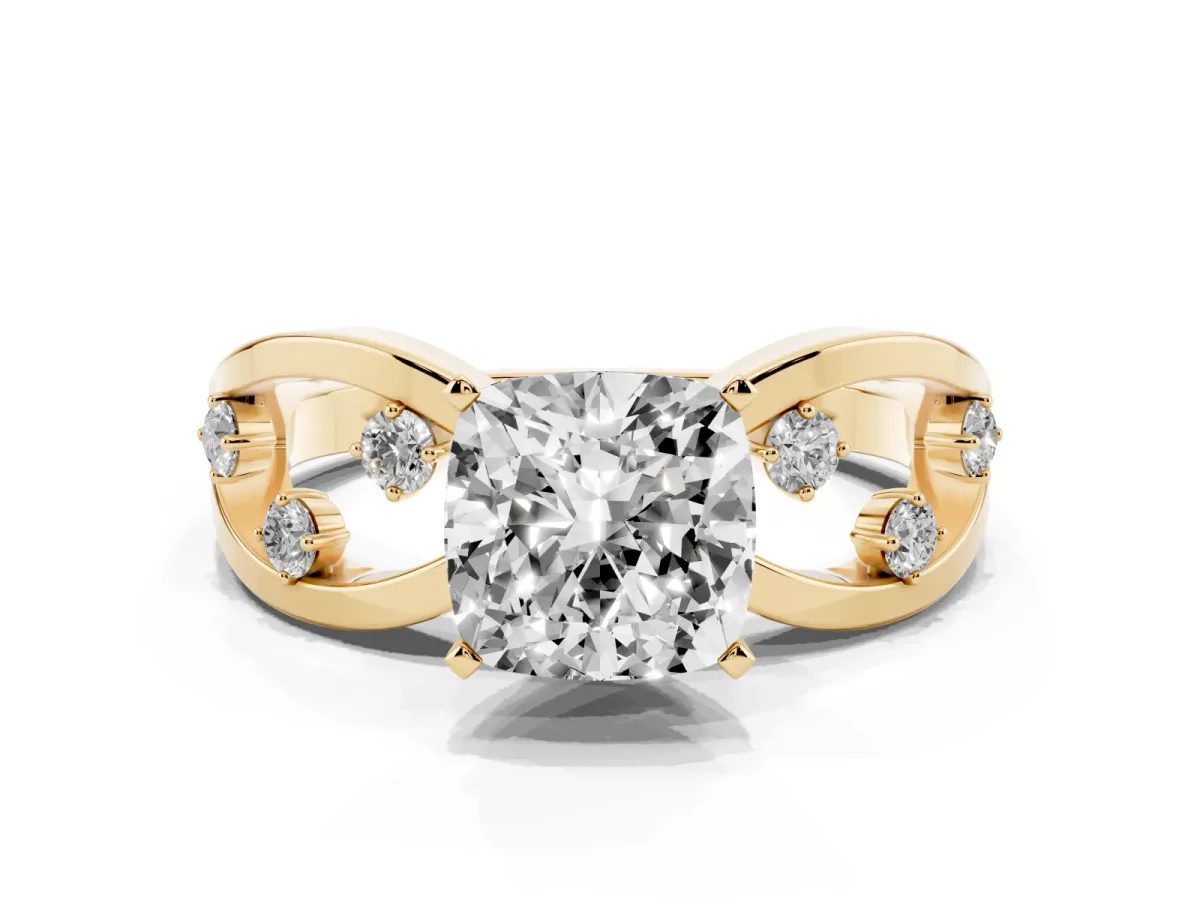 Cushion Cut Cut Solitaire Diamond with Side Stones on Criss-Cross Band and Four-Prong Setting Yellow gold
