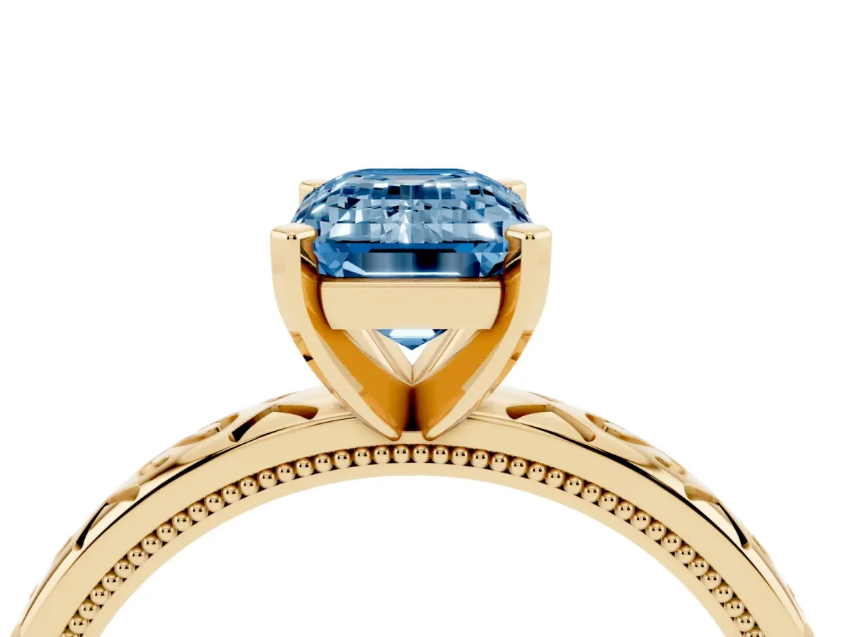 Fancy Blue Emerald Cut Solitaire Engagement Ring with Scrollwork Band and Four-Prong Setting Yellow gold