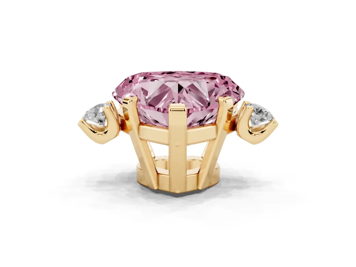 Fancy Pink Heart Cut Cut Three-Stone Solitaire Ring with Round Accent Diamonds and Four-Prong Setting Yellow gold
