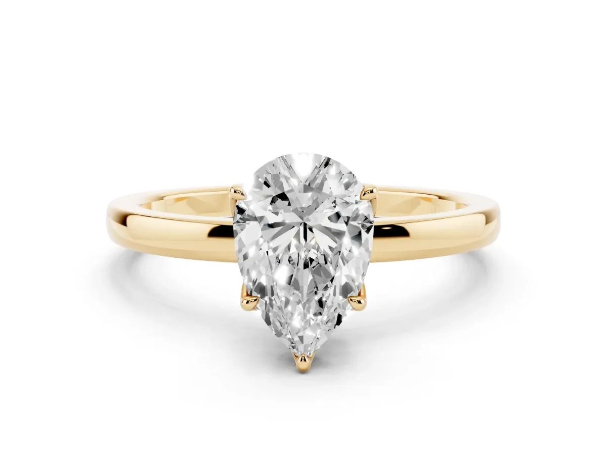 Pear Cut Diamond Solitaire Ring with Thin Band and Prong Setting Yellow gold